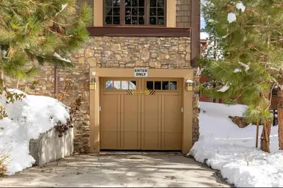 a garage door with a speed limit sign on it at Magnolia Lodge 1 in Mammoth Lakes
