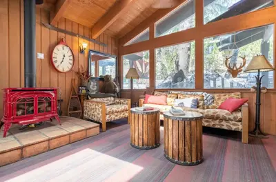 a living room with a couch and a fire place at Mammoth Estates 233 in Mammoth Lakes