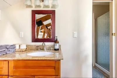 a bathroom with a sink and a mirror at Seasons Four 110 in Mammoth Lakes