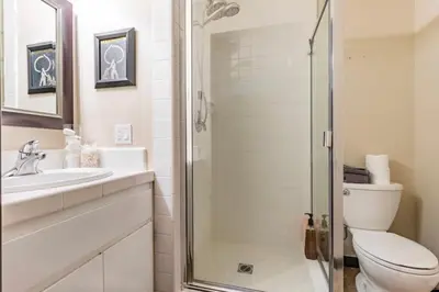 a bathroom with a shower and a toilet and a sink at Seasons Four 110 in Mammoth Lakes