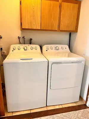 two washing machines and a sink in a room at Cozy Mammoth Ski Condo with Mtn Views and Hot Tub in Mammoth Lakes