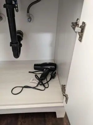 a black phone sitting on the corner of a room at 719 Mid-Town Retreat in Reno