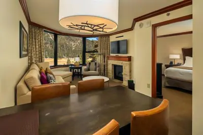 a living room with a dining table and a bedroom at Sweeping Views and Access to Slopes Everline Condo in Olympic Valley