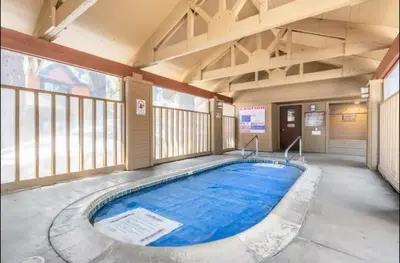 a swimming pool in the middle of a building at Snowcreek 1 in Mammoth Lakes
