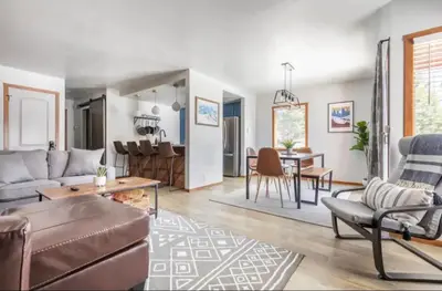 a living room with a couch and a table at Snowcreek 1 in Mammoth Lakes