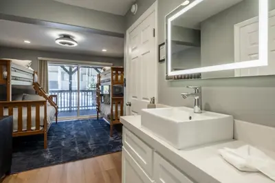 a bathroom with a white sink in a room at Chateau Blanc 1 in Mammoth Lakes
