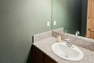 a bathroom with a sink and a mirror at High Sierra Hideaway in South Lake Tahoe