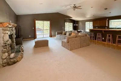 a large living room with a couch and a bar at High Sierra Hideaway in South Lake Tahoe