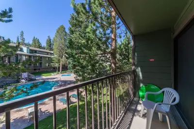 a balcony with a view of a swimming pool at Quaint 1B/1BA Canyon Lodge Condo: Jacuzzi & More! in Mammoth Lakes