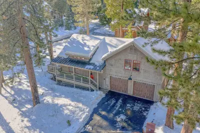 an aerial view of a house in the snow at Cozy Tahoe Getaway - Walk to Lake & Quiet Deck in Carnelian Bay