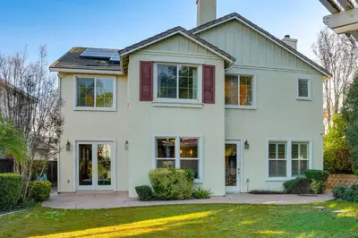 a white house with a yard at Near Wineries and Parks Waterfront Tracy Getaway! in Tracy