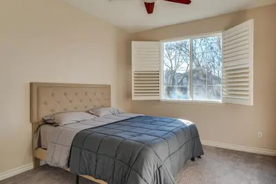 a bedroom with a bed and a window at Near Wineries and Parks Waterfront Tracy Getaway! in Tracy