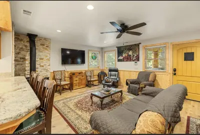 a living room with a couch and a table at Big Foot Hide Out Shaver Lake Mts in Shaver Lake