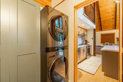 a kitchen with a stainless steel refrigerator at Cozy Tahoma Family Cabin in the Pines Sleeps 6 Pets in Tahoma