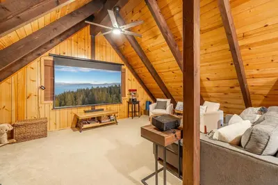a living room with a large window in a wooden cabin at Cozy Tahoma Family Cabin in the Pines Sleeps 6 Pets in Tahoma
