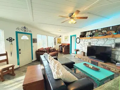 a living room with a couch and a fireplace at Hot Tub, Farm Chic Shingle Springs Birders Heaven in Shingle Springs