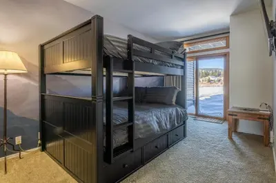 a bedroom with a bunk bed in a room at Snowcreek 704 in Mammoth Lakes