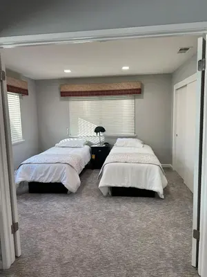 a bedroom with two beds and a window at The gorgeous in Citrus Heights