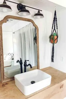 a bathroom with a white sink and a mirror at Yosemite Boho Bungalow, Pet Friendly & Mtn Views! in Coarsegold