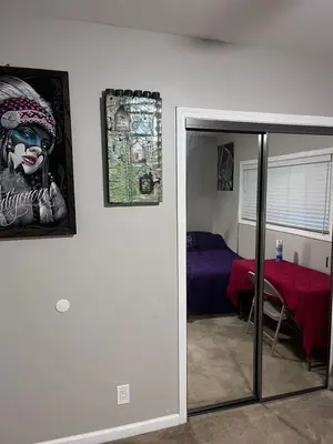 a room with a mirror and a room with a bed at 35th Avenue room for rent in Sacramento