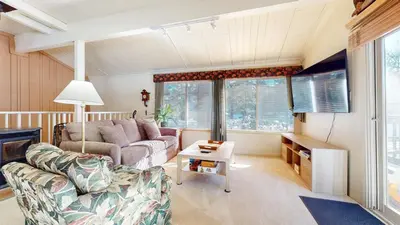 a living room with a couch and a table at Timberline #08 condo in Mammoth Lakes