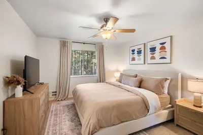a bedroom with a bed and a ceiling fan at Modern Cabin Escape wGame Room, Huge Deck, WIFI in Arnold