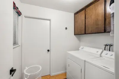 a white laundry room with a washer and dryer at Modern Cabin Escape wGame Room, Huge Deck, WIFI in Arnold