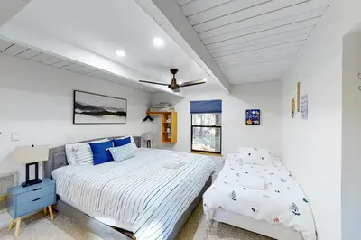 a bedroom with a bed and a ceiling fan at Yosemite Escape in White Wolf