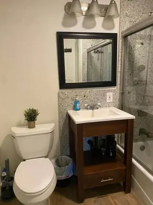 a bathroom with a toilet and a sink and a mirror at Kipps Hill Haven A - Folsom Lake Escape in El Dorado Hills