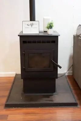 a black fireplace with a sign on top of it at Kipps Hill Haven B — Folsom Lake Escape in El Dorado Hills