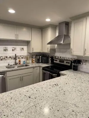 a kitchen with white cabinets and a granite counter top at Kipps Hill Haven B — Folsom Lake Escape in El Dorado Hills