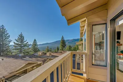 a house with a balcony with a view of the mountains at Incline Village Views - Pellet Stove Deck in Incline Village