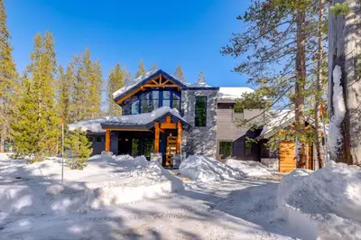 a house in the woods with snow on the ground at Steps From Sledding Hill! Soda Springs Mtn Retreat in Soda Springs