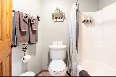 a small bathroom with a toilet and a shower at Sierra Park Villas 28 in Mammoth Lakes