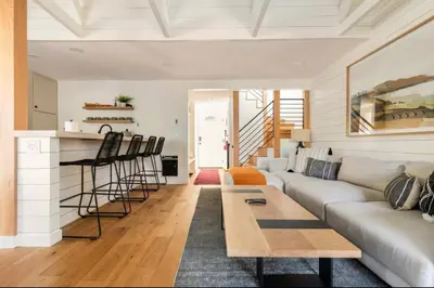a living room with a couch and a table at Seasons Four 152 in Mammoth Lakes