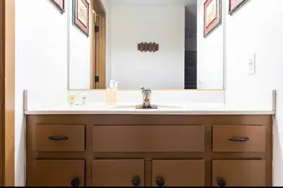 a bathroom sink with a large mirror above it at Winterset 4 in Mammoth Lakes