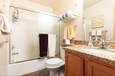 a bathroom with a white toilet and a sink at San Sierra 24 in Mammoth Lakes