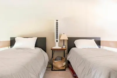 two beds sitting next to each other in a room at Snowcreek 569 in Mammoth Lakes