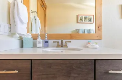 a bathroom with a sink and a mirror at Mammoth Sierra Townhome 1 in Mammoth Lakes