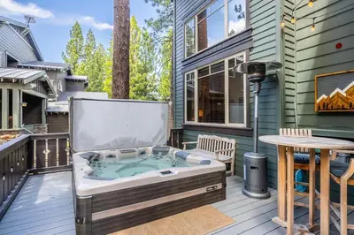 a hot tub on the deck of a house at Timbers 1057 in Mammoth Lakes
