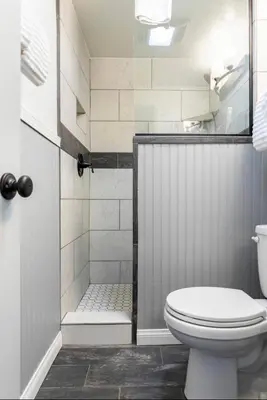 a bathroom with a toilet and a walk in shower at Villa De Los Pinos 15 in Mammoth Lakes