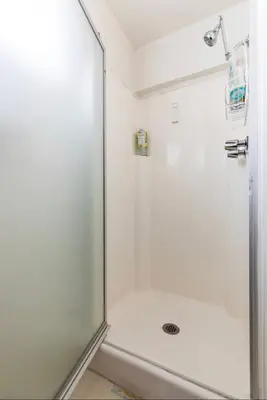 a shower with a glass door in a bathroom at Mammoth View Villas 39 in Mammoth Lakes