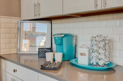 a counter with cups and slippers on a counter in a kitchen at Stunning View! UNR-Groups-Deck-Reno-Minerva House in Reno