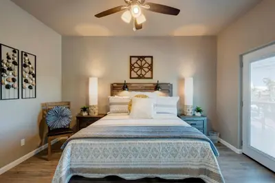 a bedroom with a bed and a ceiling fan at Stunning View! UNR-Groups-Deck-Reno-Minerva House in Reno
