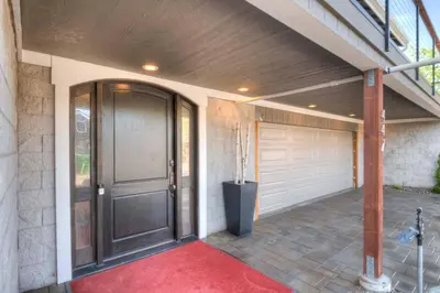 a garage with a black door and a red rug at Stunning View! UNR-Groups-Deck-Reno-Minerva House in Reno