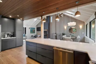 an open kitchen with a large white counter top at Sierra Sanctuary with Hot Tub home in Truckee