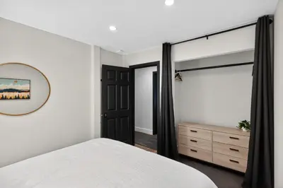 a bedroom with a bed and a mirror and a dresser at Sierra Sanctuary with Hot Tub home in Truckee