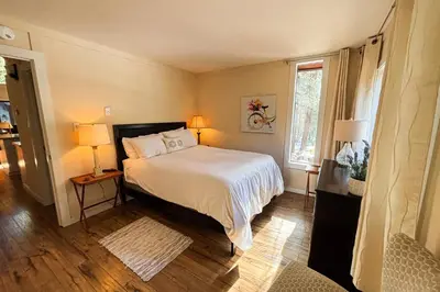 a bedroom with a white bed and two lamps at Double Suite Diamond Retreat in Incline Village