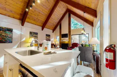 a kitchen with a sink and a living room at Double Suite Diamond Retreat in Incline Village