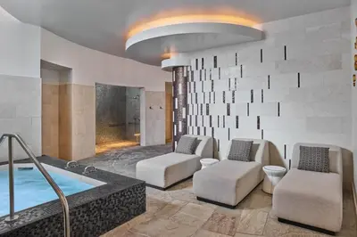 a living room with a hot tub and two chairs at Ritz-Carlton Northstar Luxury Ski-In Ski-Out in Truckee